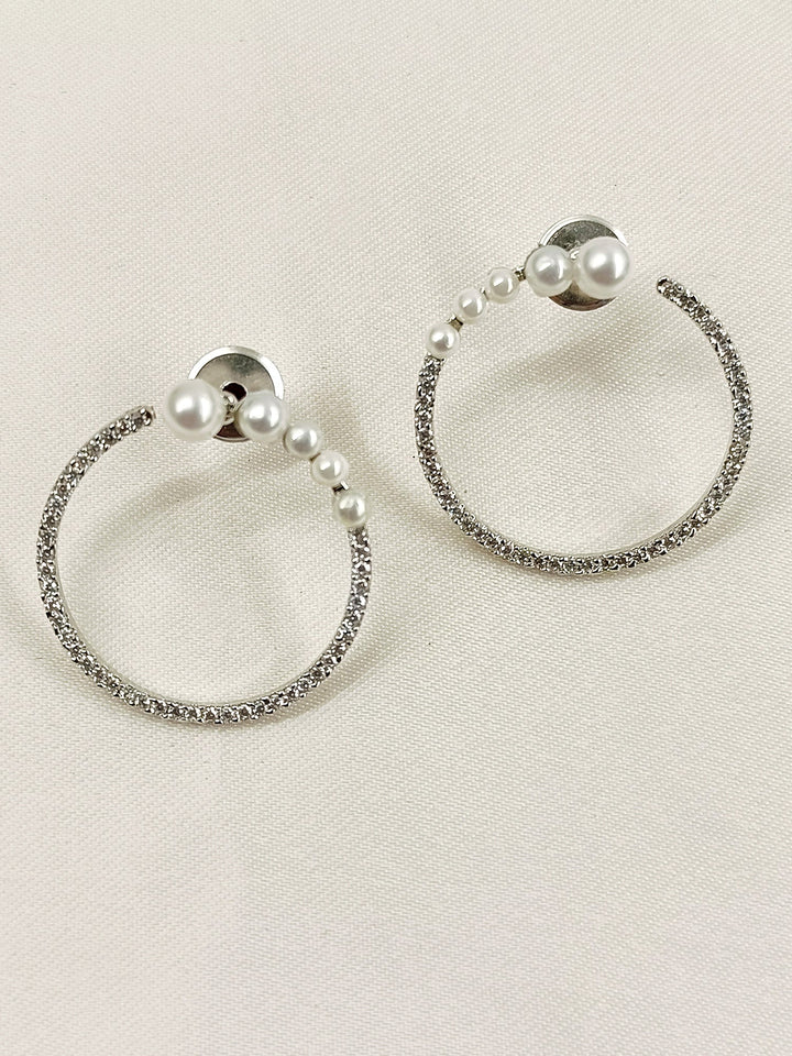 Elegant and sophisticated earrings with white American diamond and silver plated brass metal