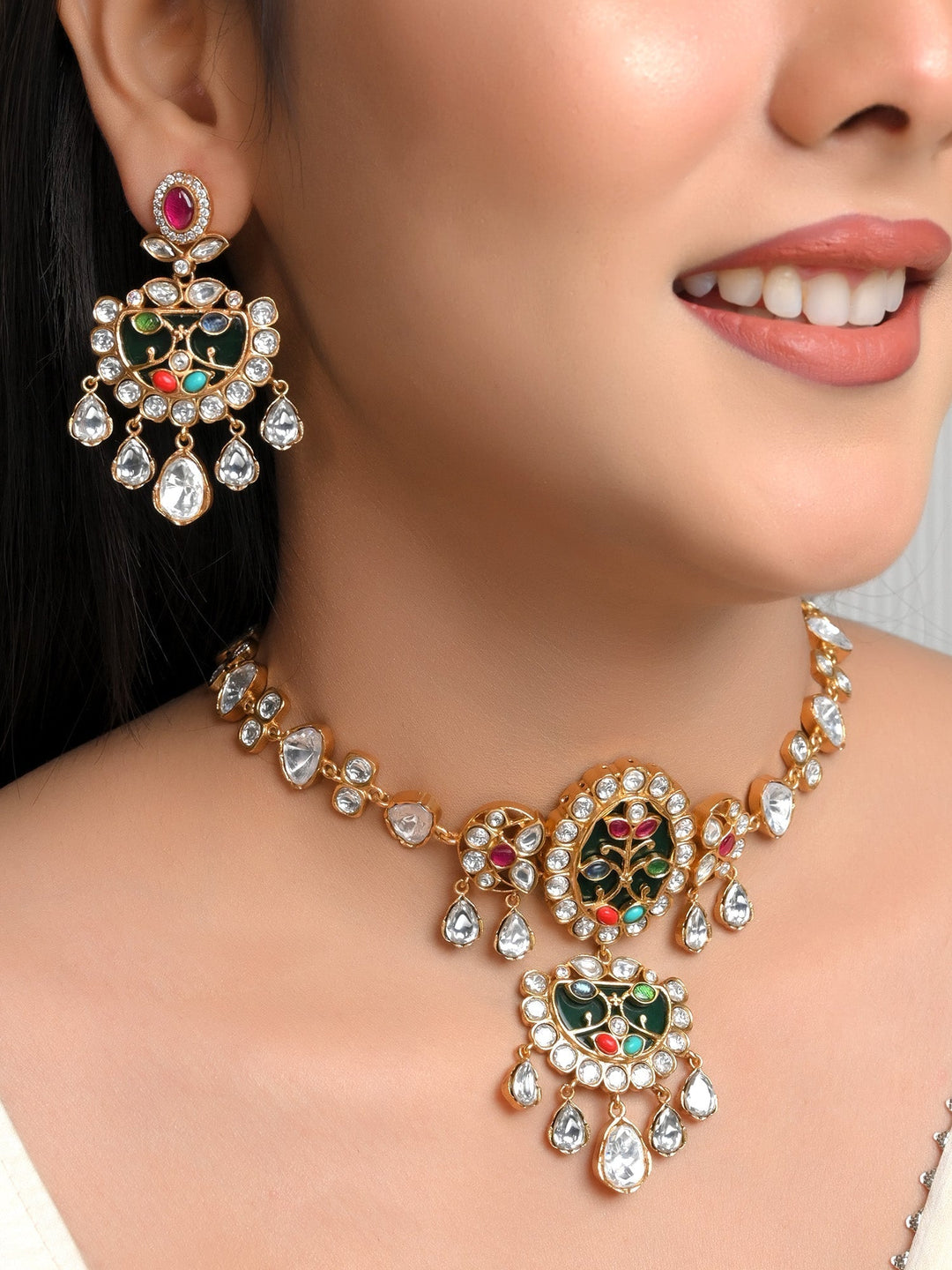 Gorgeous choker set featuring gold plated brass metal, polki, and natural pearl for a traditional and stunning look