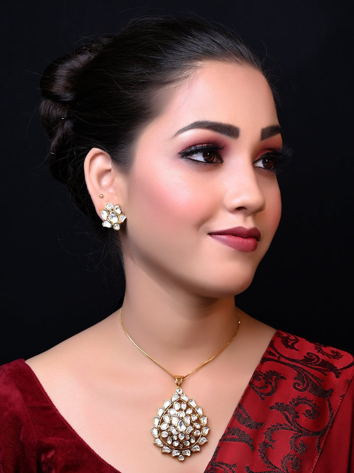 Pranshi White Kundan Pendant Set with finely detailed kundan setting on a brass metal base with gold plating 