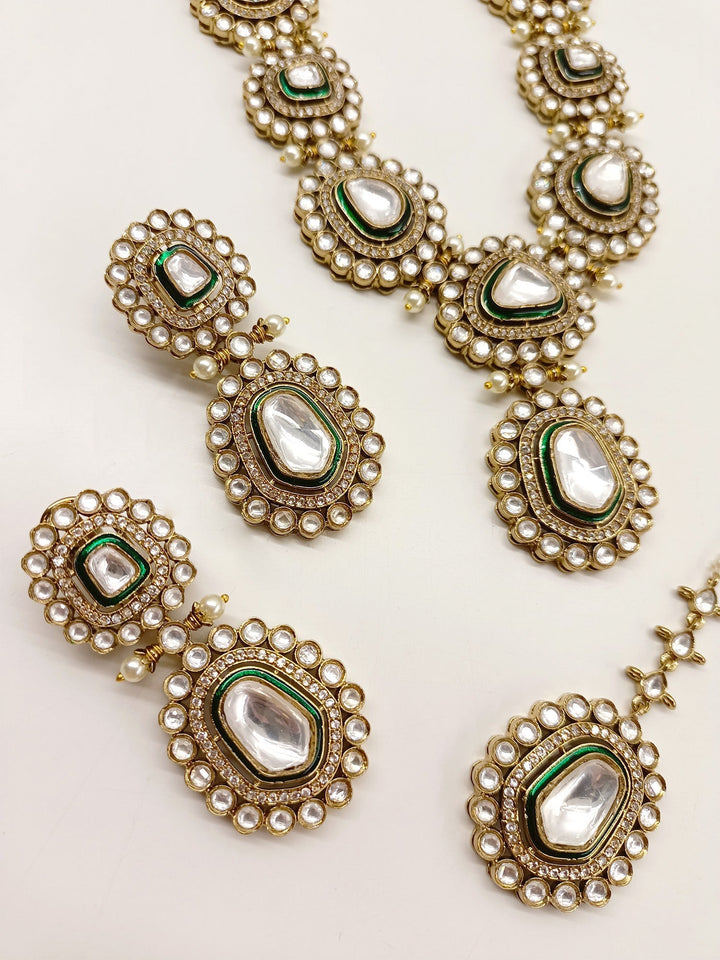  Beautiful Green Polki Necklace Set, made from high quality antique gold plated brass metal and featuring stunning pearls with American diamond setting, a timeless and traditional bridal wear accessory