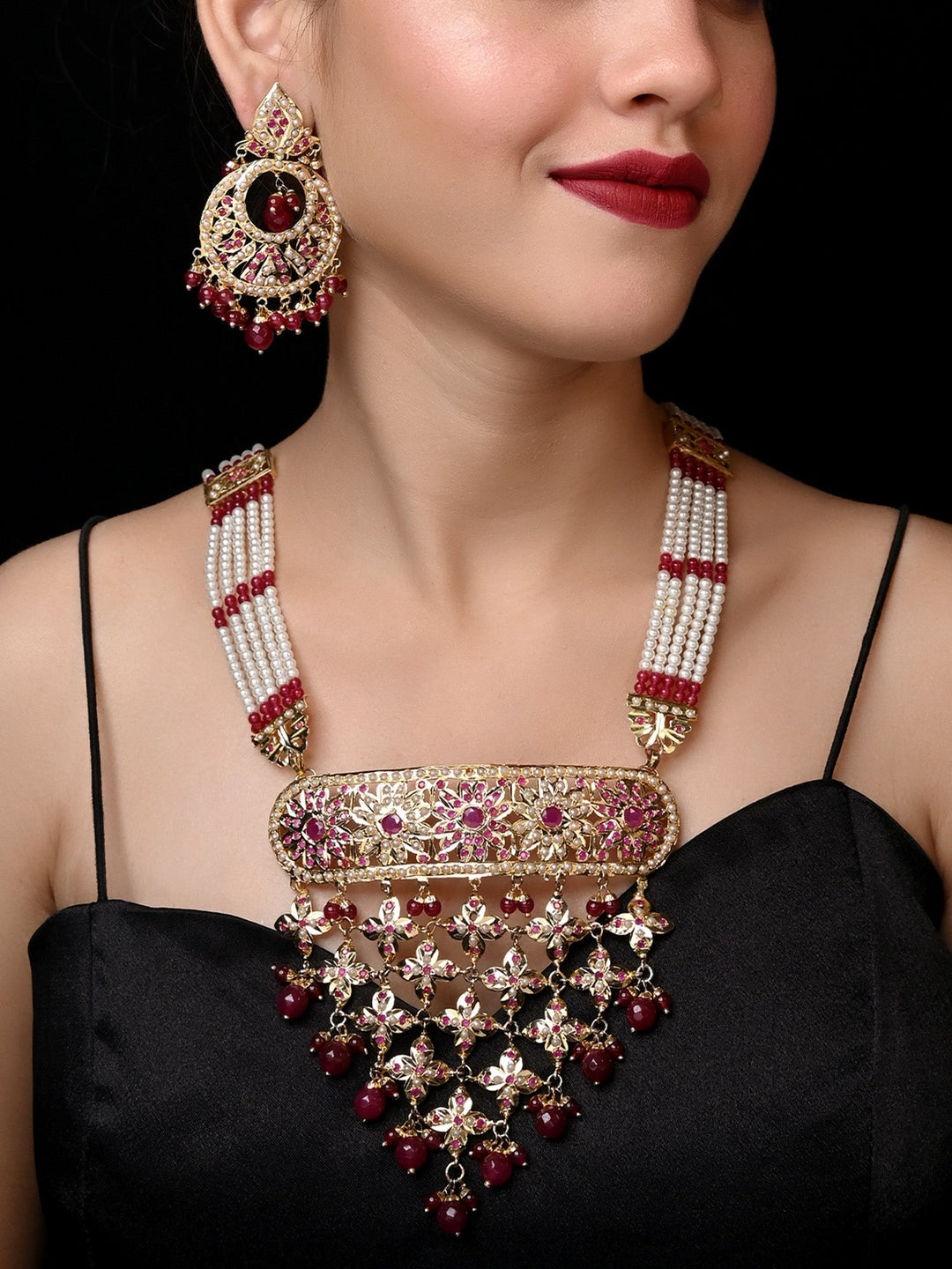  Beautiful jadau necklace set featuring stunning ruby stones and durable brass metal