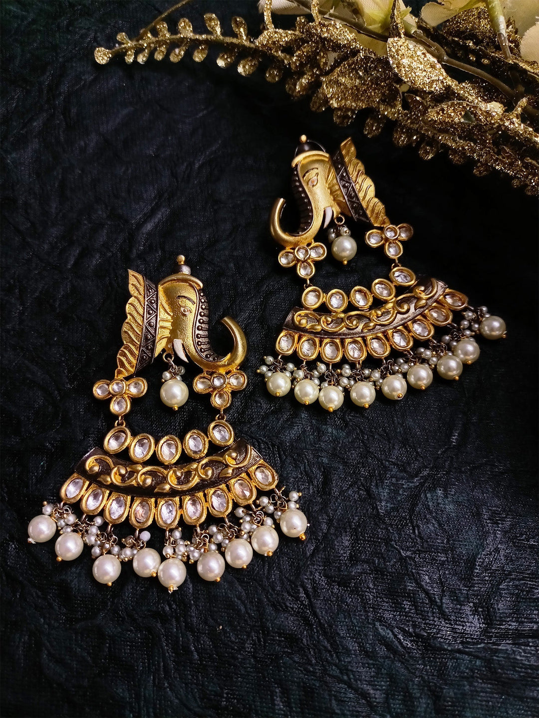 Beautiful gold and kundan earrings in the shape of elephants