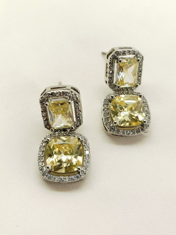  High-quality Rituja Yellow Stone Silver Plated Diamond Earrings with eye-catching American Diamond and yellow stone embellishments