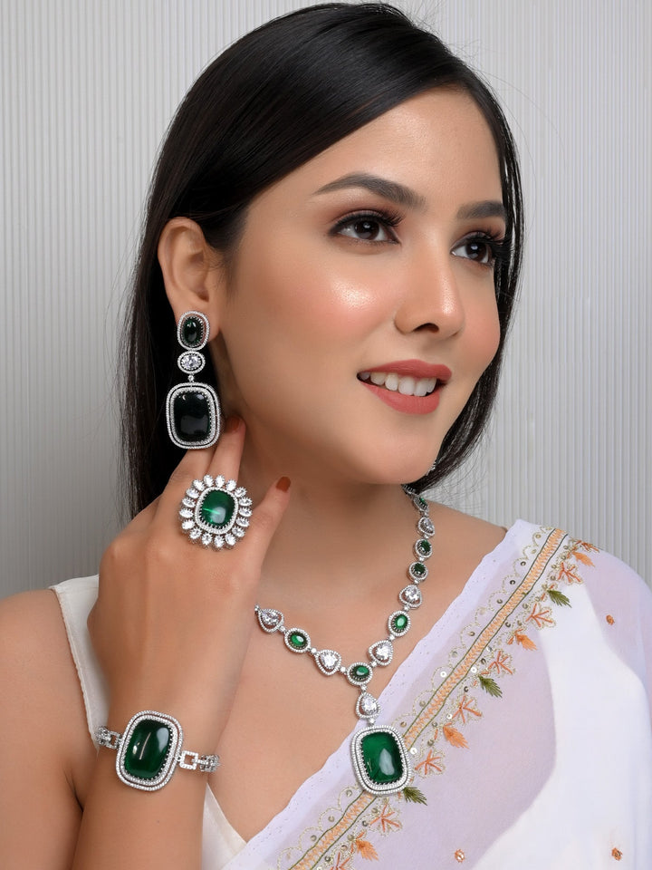 
Green American Diamond Necklace Set crafted with silver plated brass metal