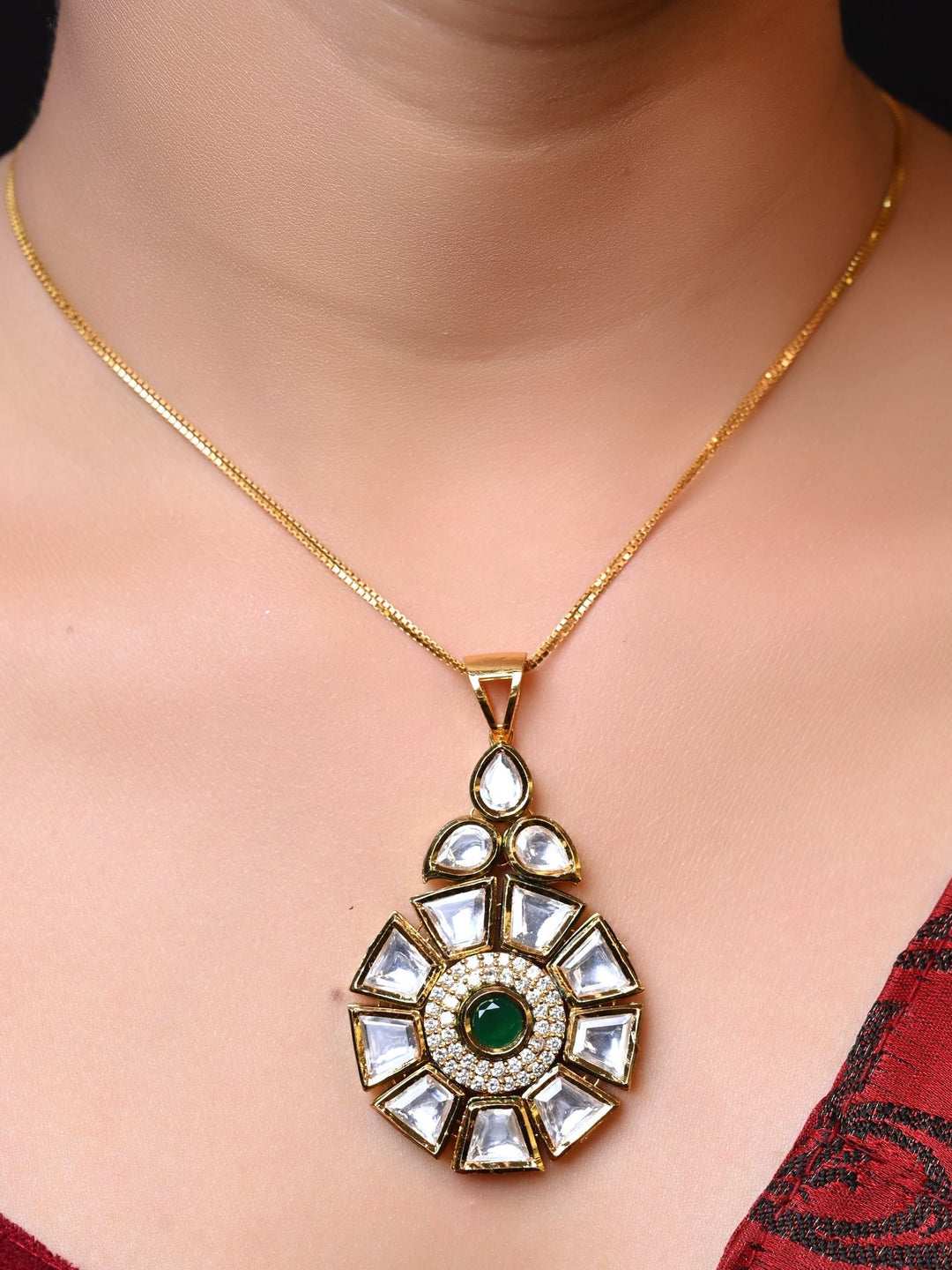 Ragvi Green Kundan Pendant Set with intricate gold detailing and matching earrings