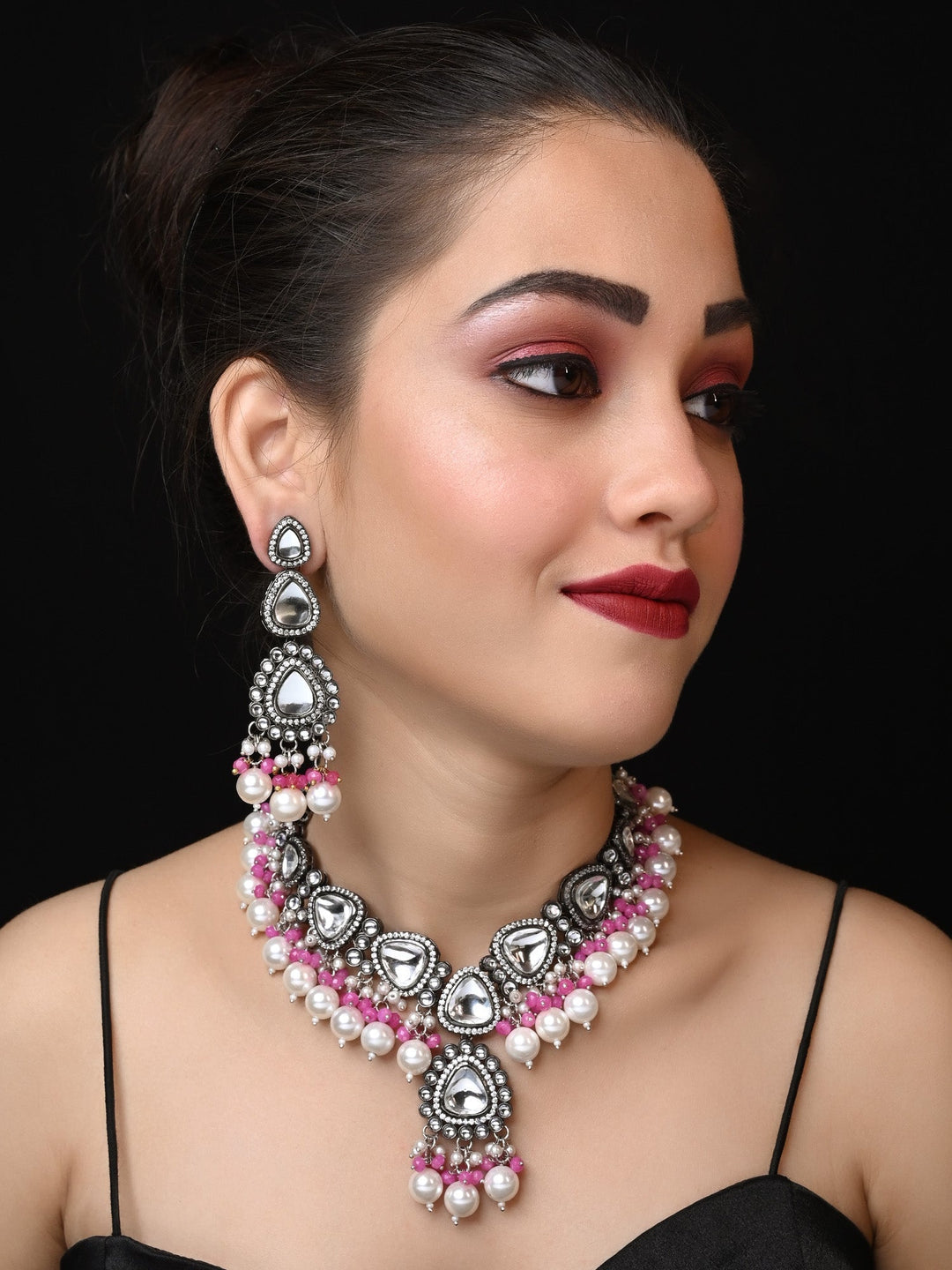 Poornima Pink Kundan Necklace Set with intricate gold detailing and matching earrings