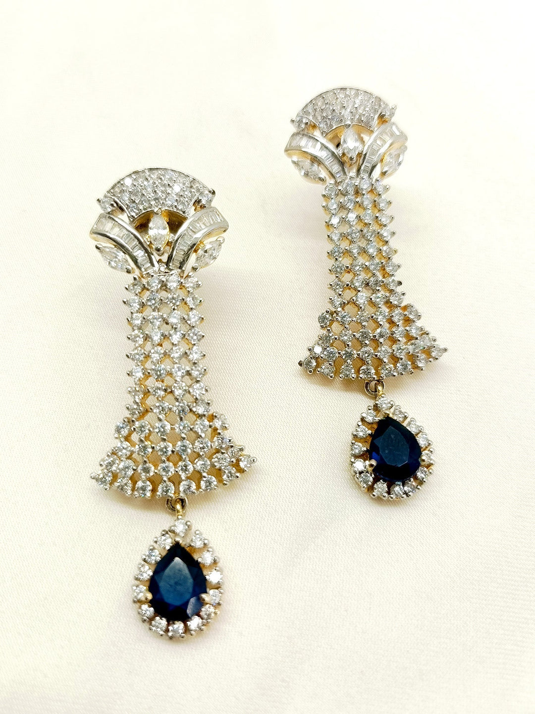  Elegant American diamond earrings featuring beautiful blue sapphire stone