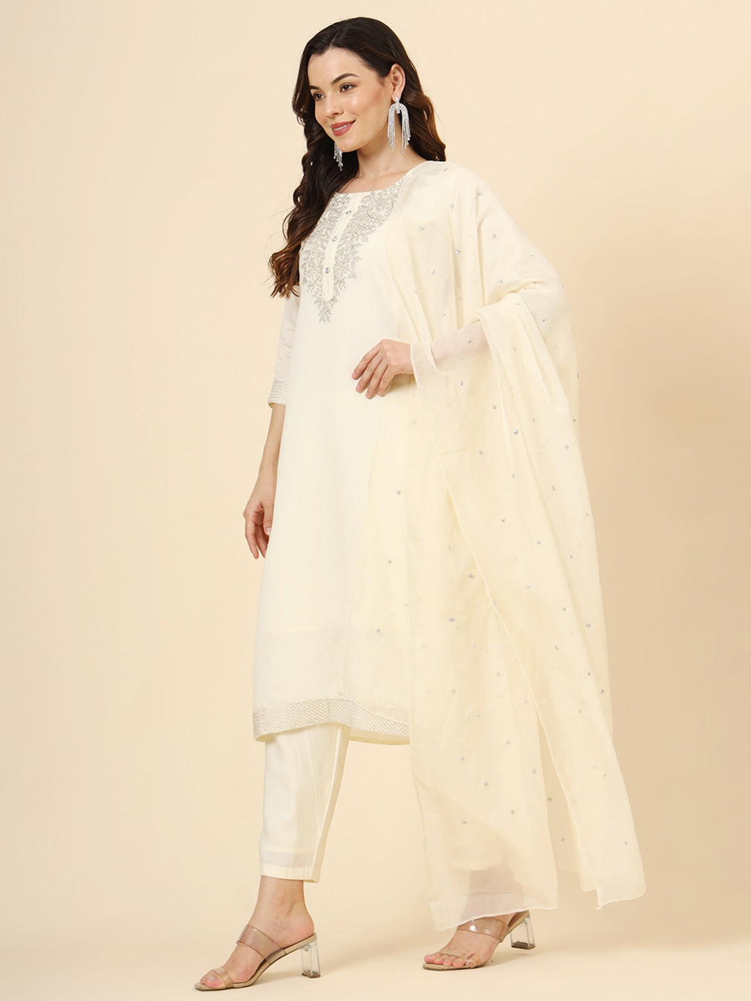 Elegant cream muslin silk pant suit with intricate embroidery and coordinating organza dupatta