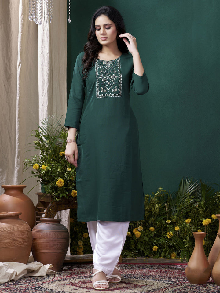 Elegantly designed green suit for festivals and family gatherings