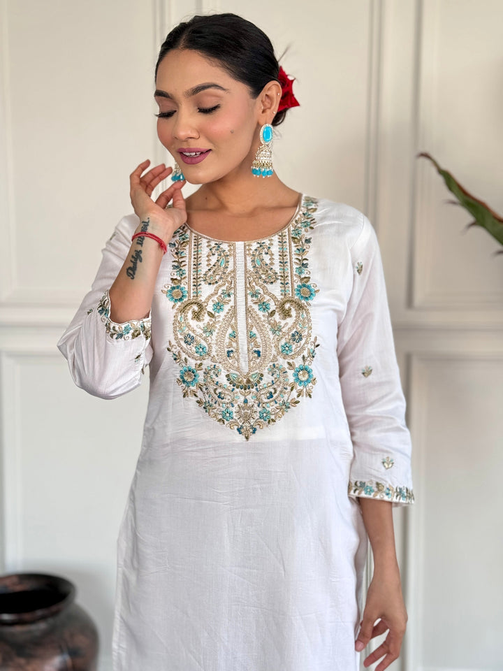 Fascinating white embroidered Chanderi silk pant suit for special events