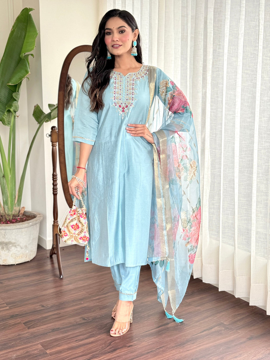 Exquisite sky-blue Chanderi silk suit adorned with traditional craftsmanship and modern design

