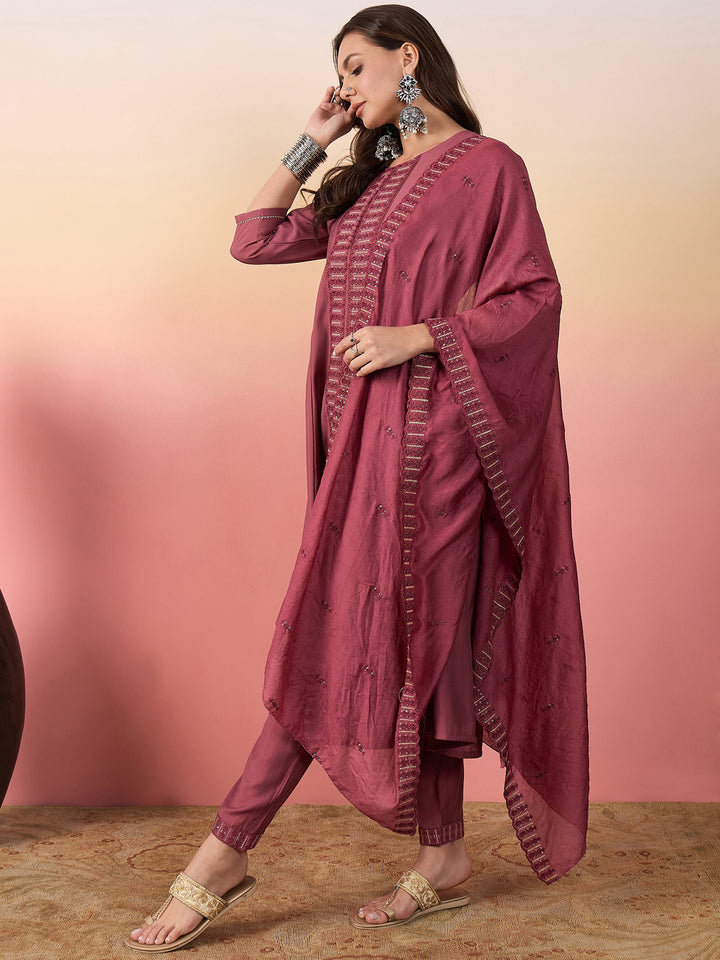 Beautifully embroidered pink silk suit with intricate work