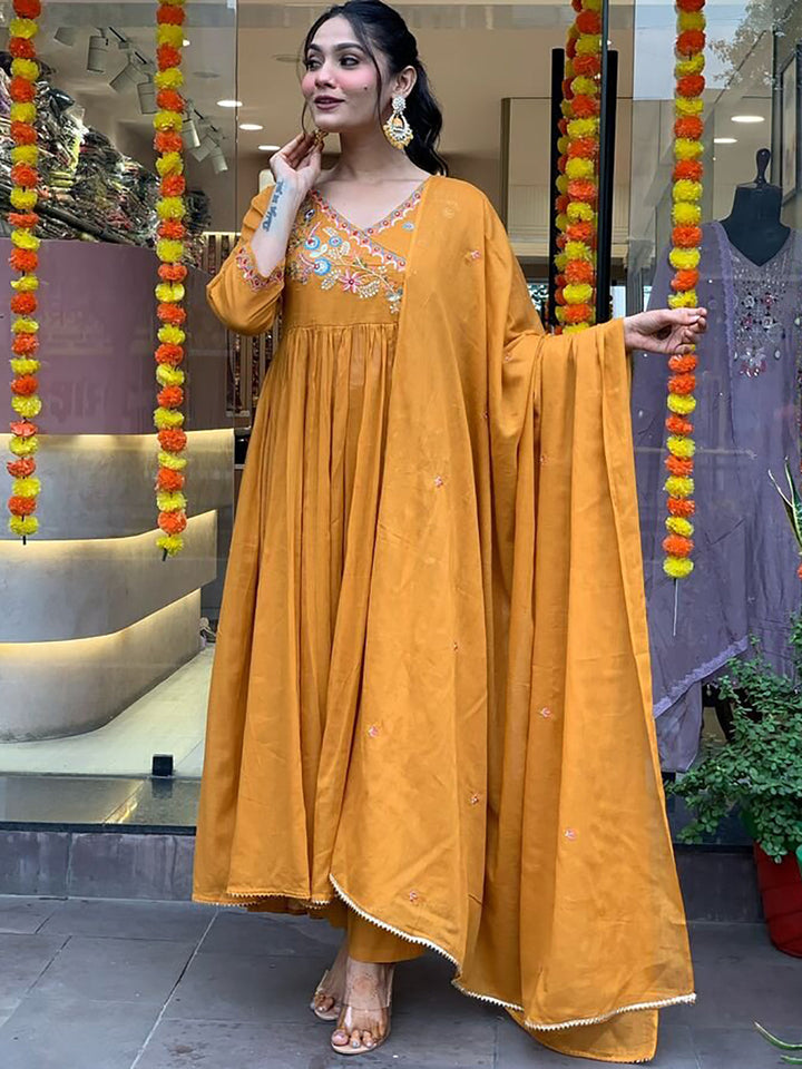 Mustard yellow embroidered pant suit with matching dupatta made of viscose fabric