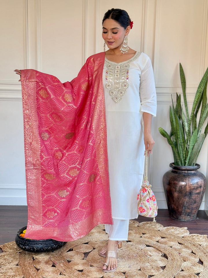 Off-white chanderi pant suit with intricate embroidery and traditional design