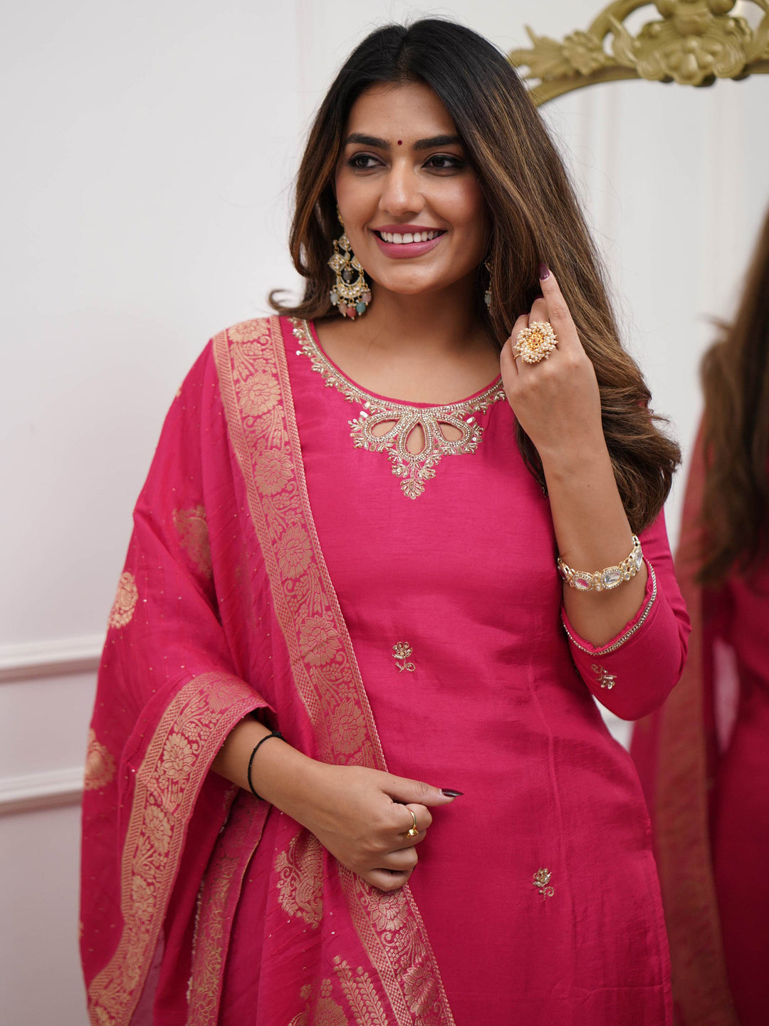 Ensemble exudes timeless charm and sophistication with matching rani pink viscose pant