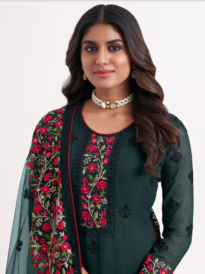Dull santoon inner material green salwar suit with sequins and butti embroidery