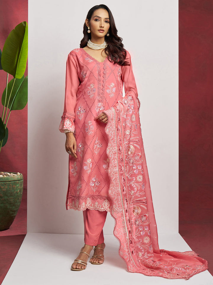 Lovely Peach Floral Embroidered Organza Festival Wear Pant Suit with Heavy Dupatta outfit on a mannequin with intricate floral embroidery and matching dupatta