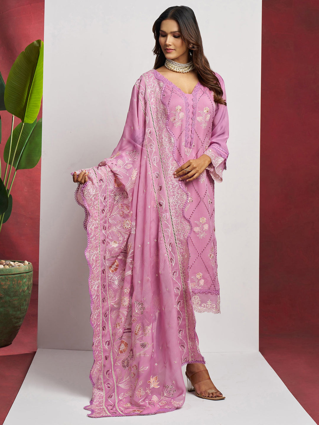Elegant pink organza suit with intricate floral thread embroidery and sequin work