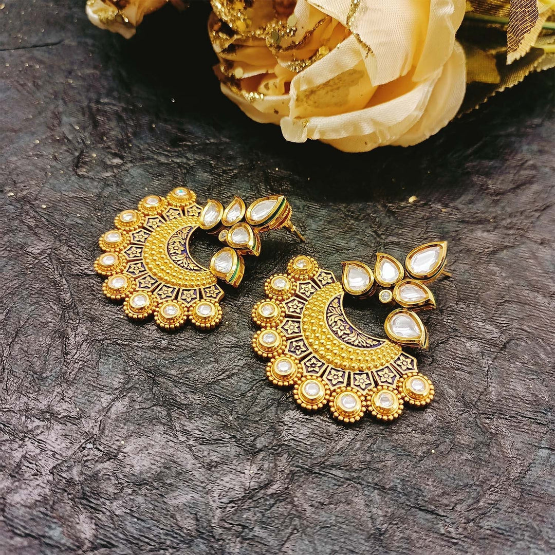 Beautiful Anuja earrings with intricate blue Meenakari design and Kundan stones