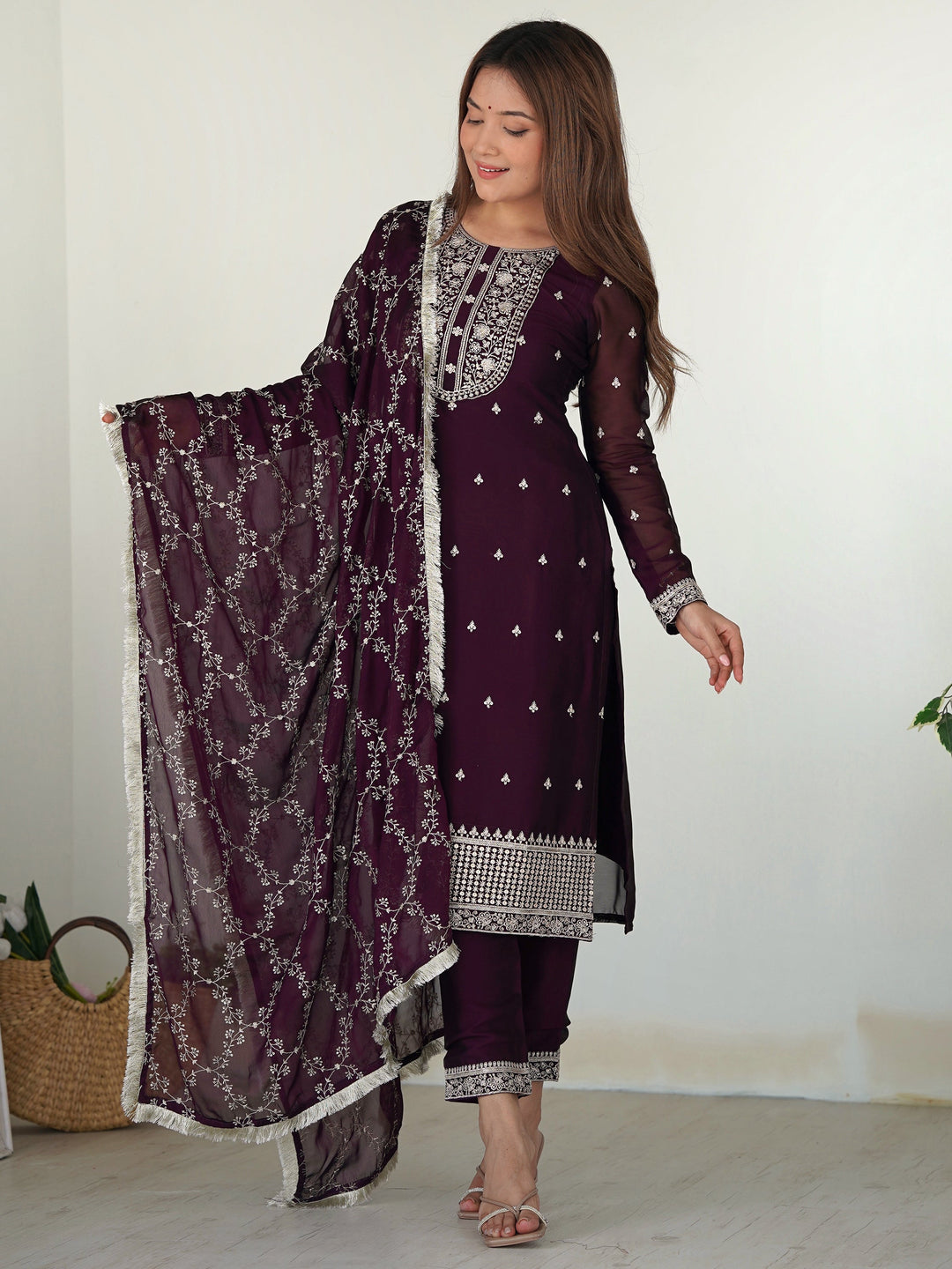 Purple silk pant suit with intricate embroidery, paired with matching dupatta