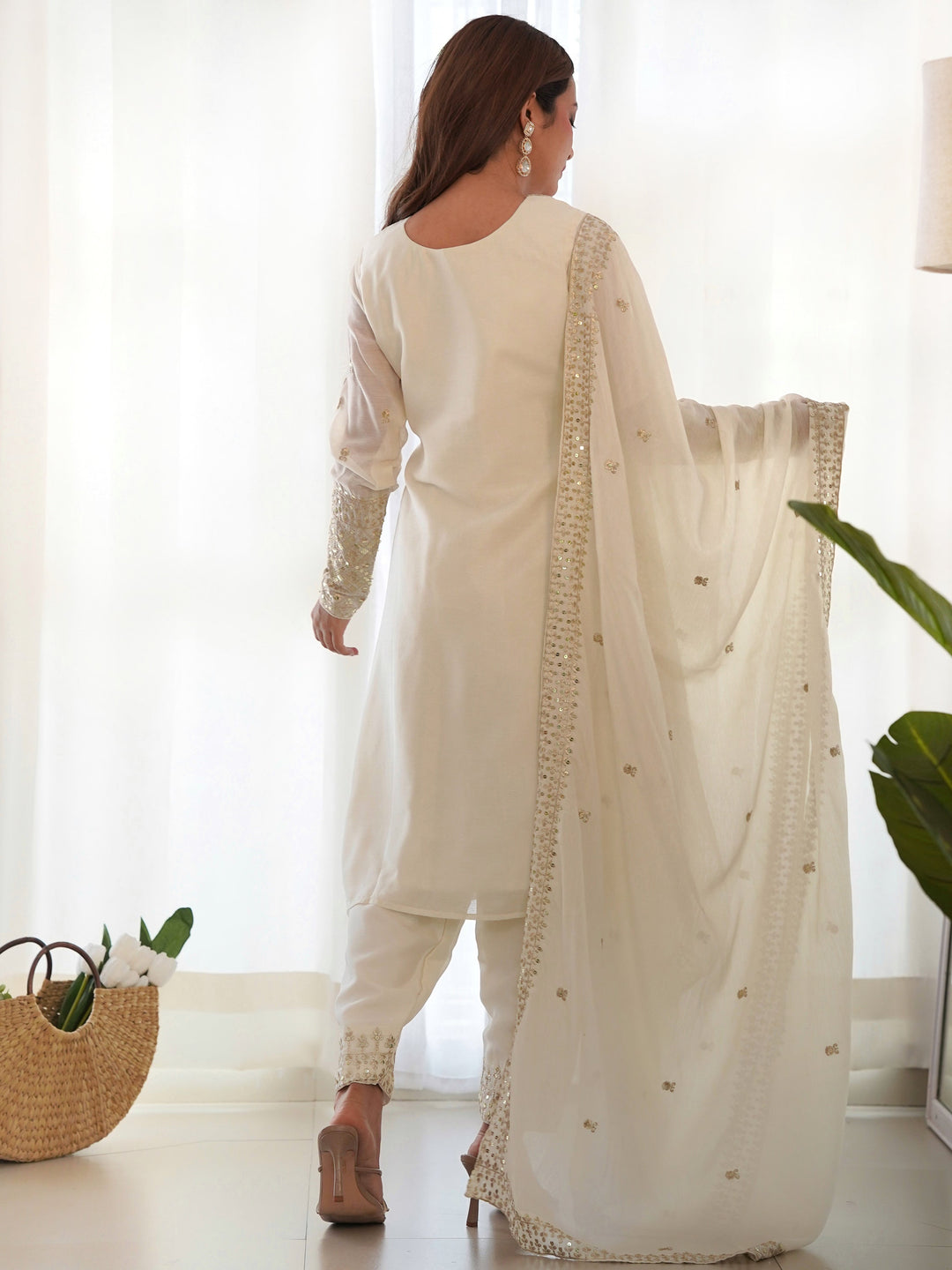 Intricate sequin embroidery and delicate zari work on the yoke and sleeves