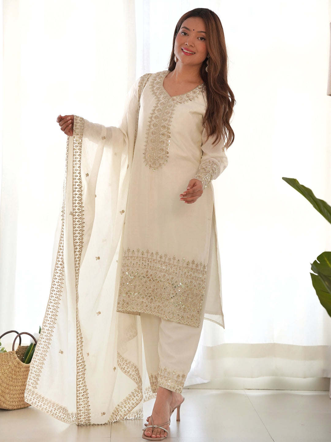 Adorable White Sequins Chinon Silk Eid Special Pant Suit with intricate sequin embroidery and delicate zari work on the yoke and sleeves