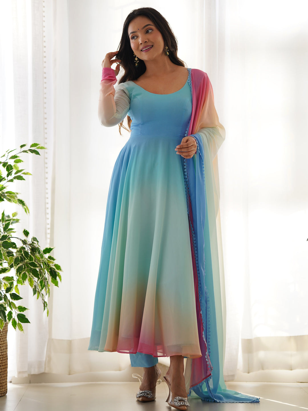 Striking georgette Anarkali suit with sky-blue silk pant and lace adorned dupatta
