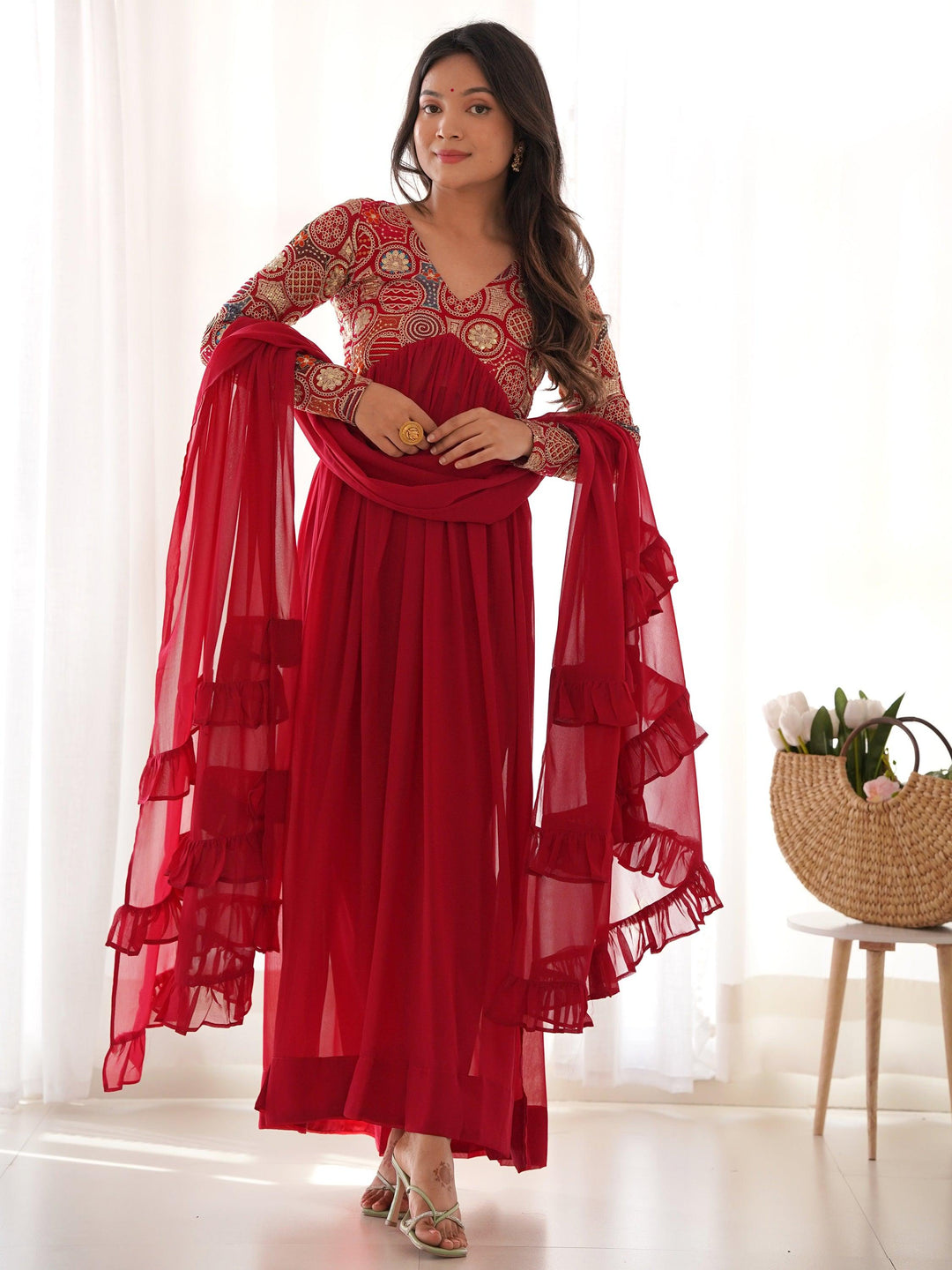 

Red georgette Anarkali suit with sequin work and dori detailing