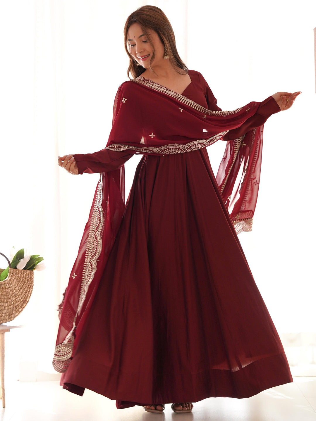 Maroon silk traditional Anarkali suit with dupatta on hanger