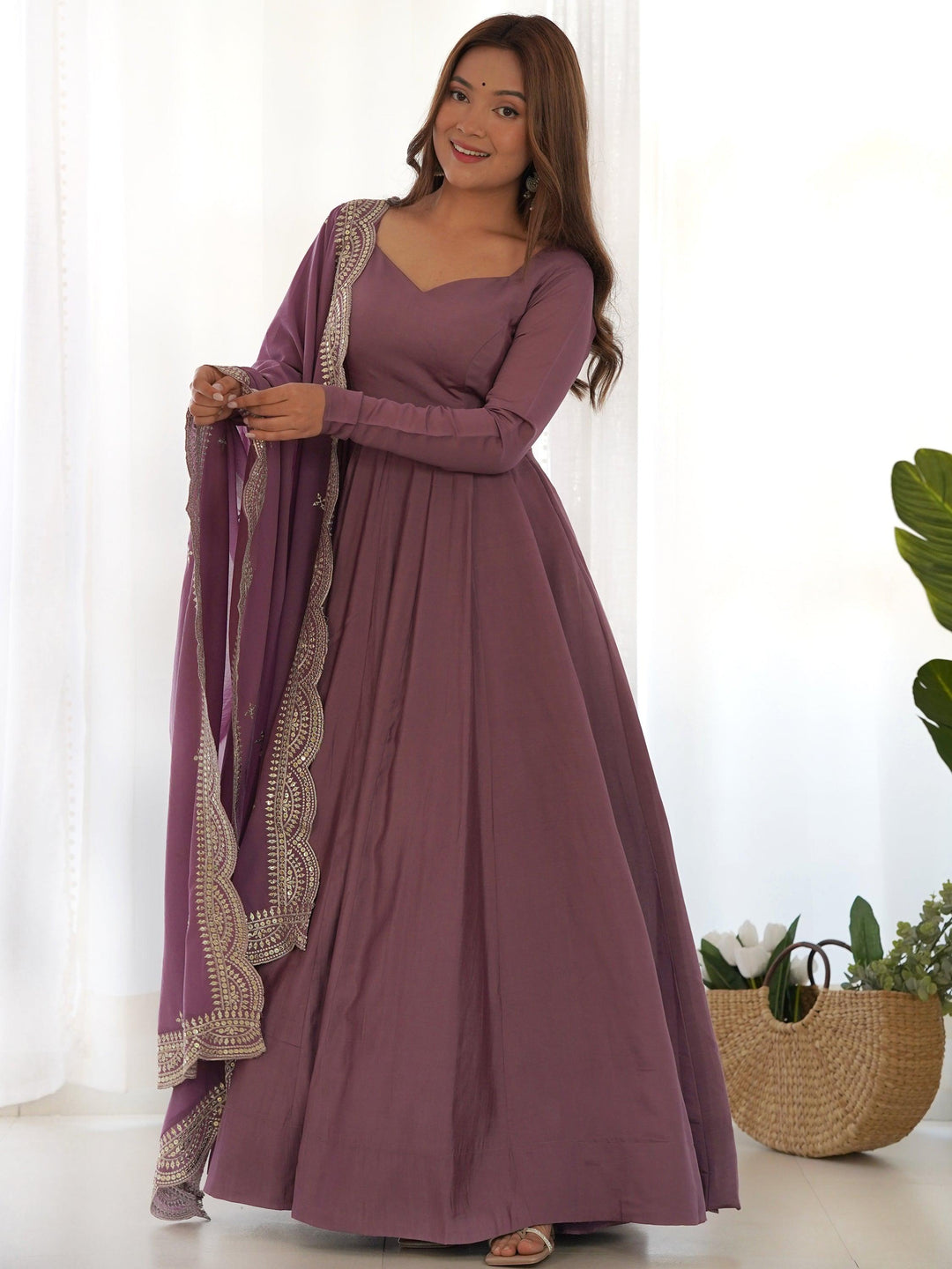 Bewitching purple silk festival wear Anarkali suit with matching dupatta and intricate embroidery