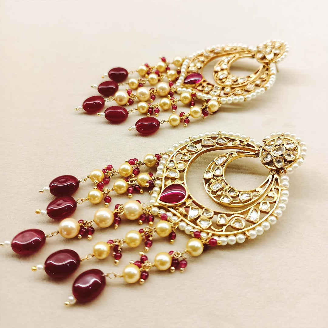  Intricate gold plated Kundan earrings with long danglers