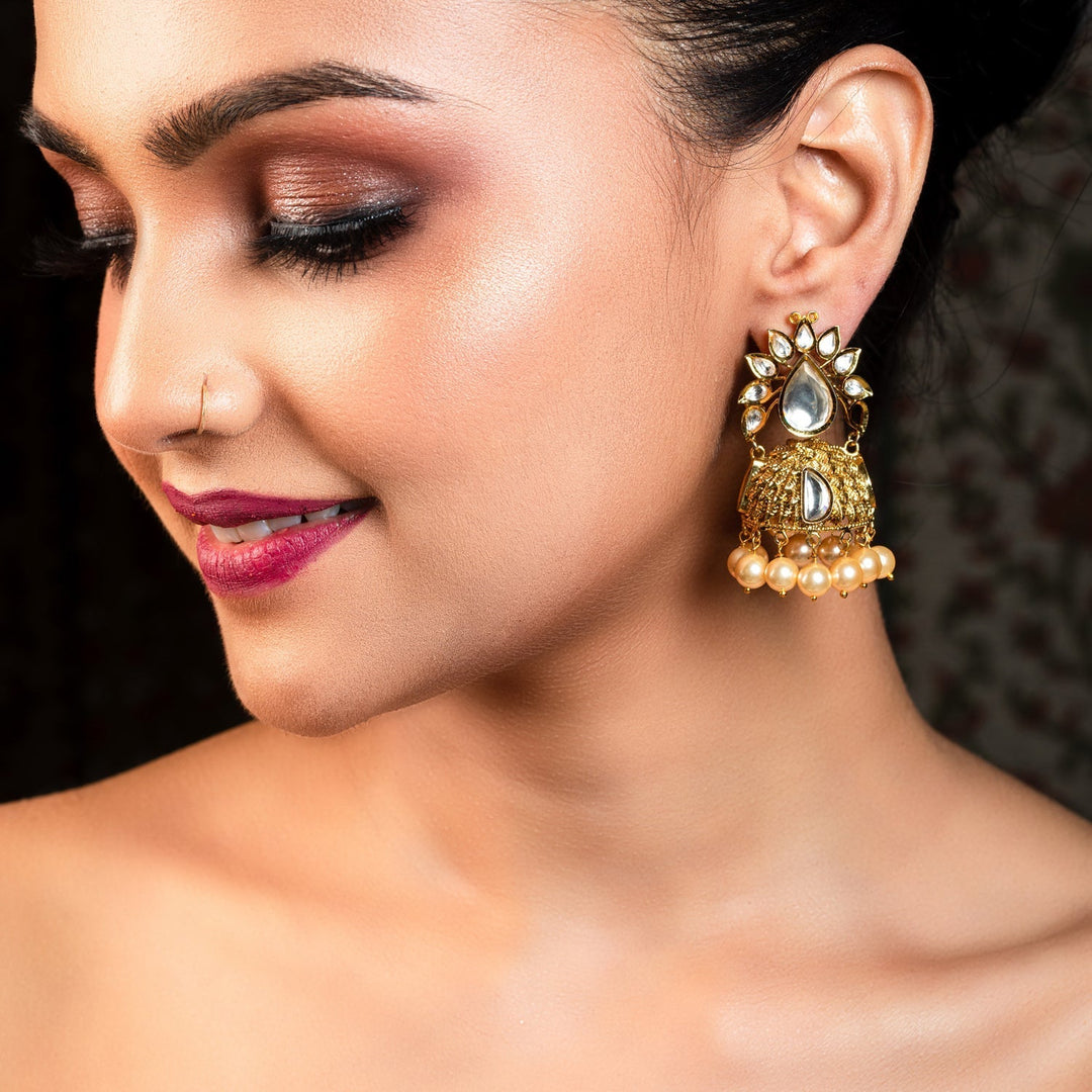 Gold plated jhumki earrings with kundan stones and small pearl hanging