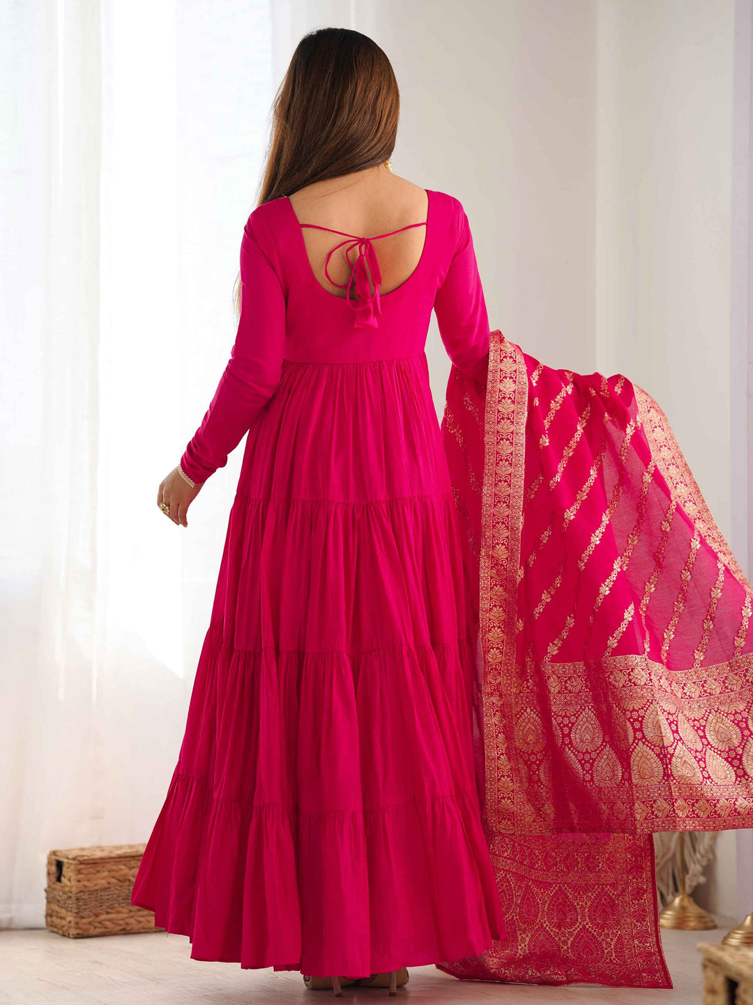 Hot pink chanderi pants perfectly complementing the anarkali's elegance