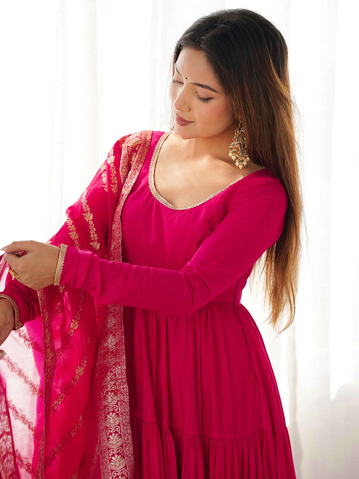 Vibrant hot pink anarkali suit perfect for festive occasions and events