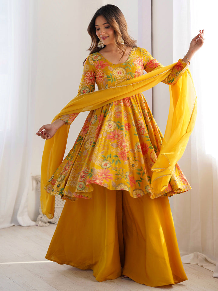 

Adorable yellow floral printed silk haldi wear palazzo suit 
