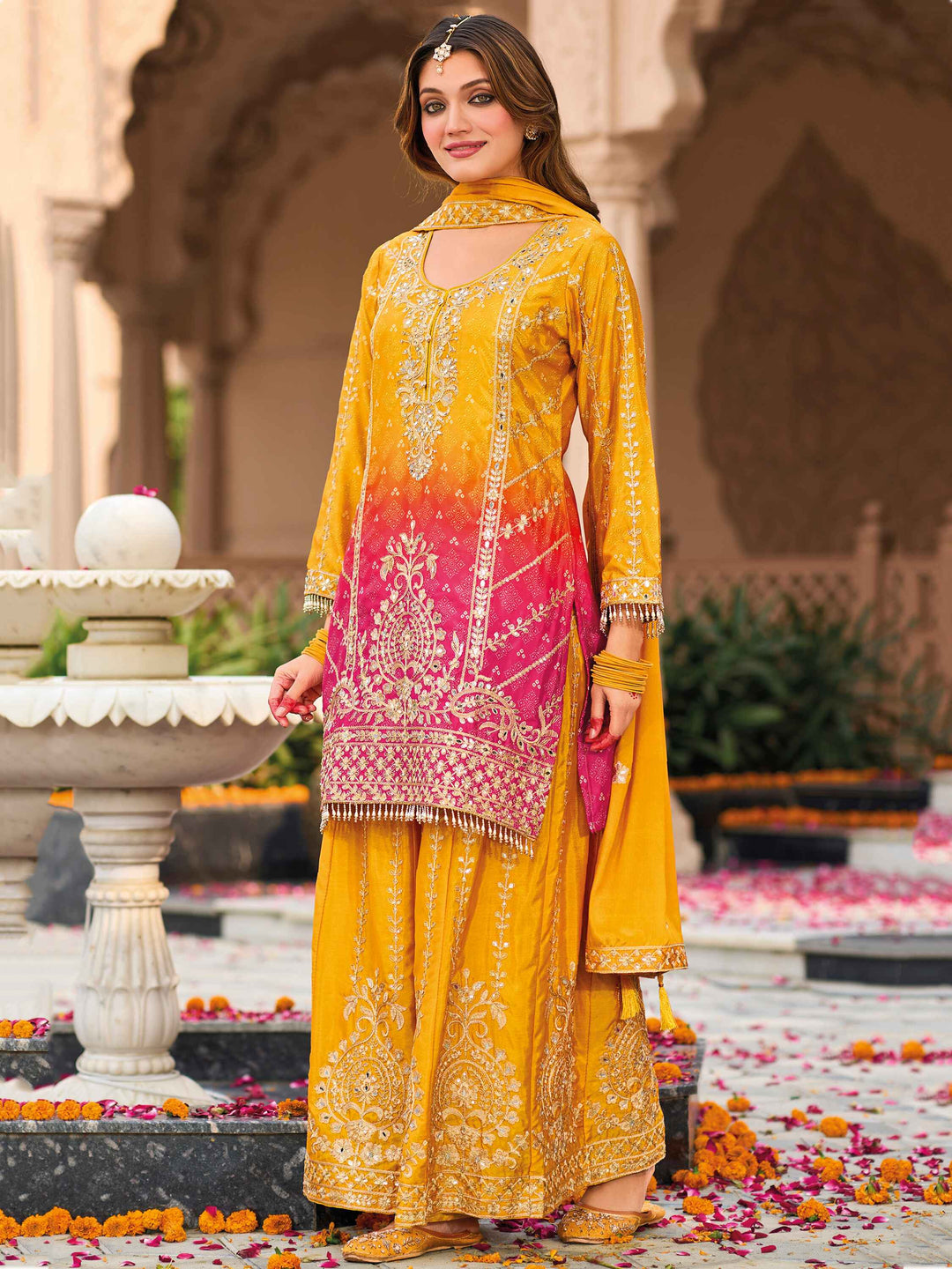 Yellow heavy chinon suit with mirror work and sequins