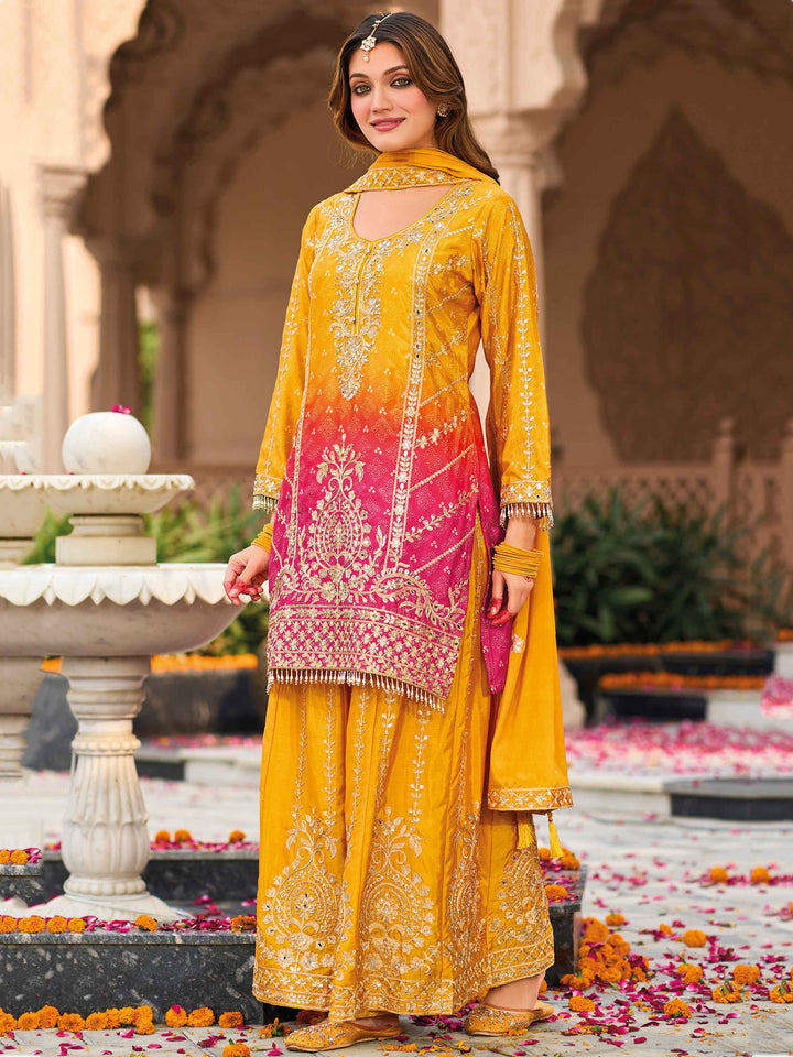 Yellow heavy chinon suit with mirror work and sequins