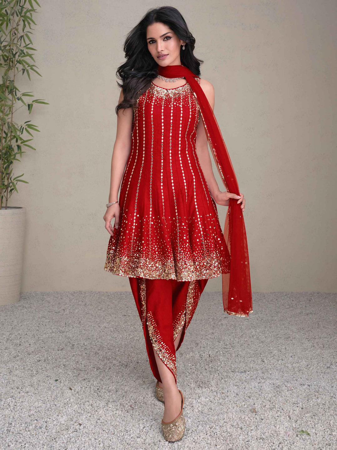 Stunning red silk dhoti suit with intricate sequin work and elegant net dupatta