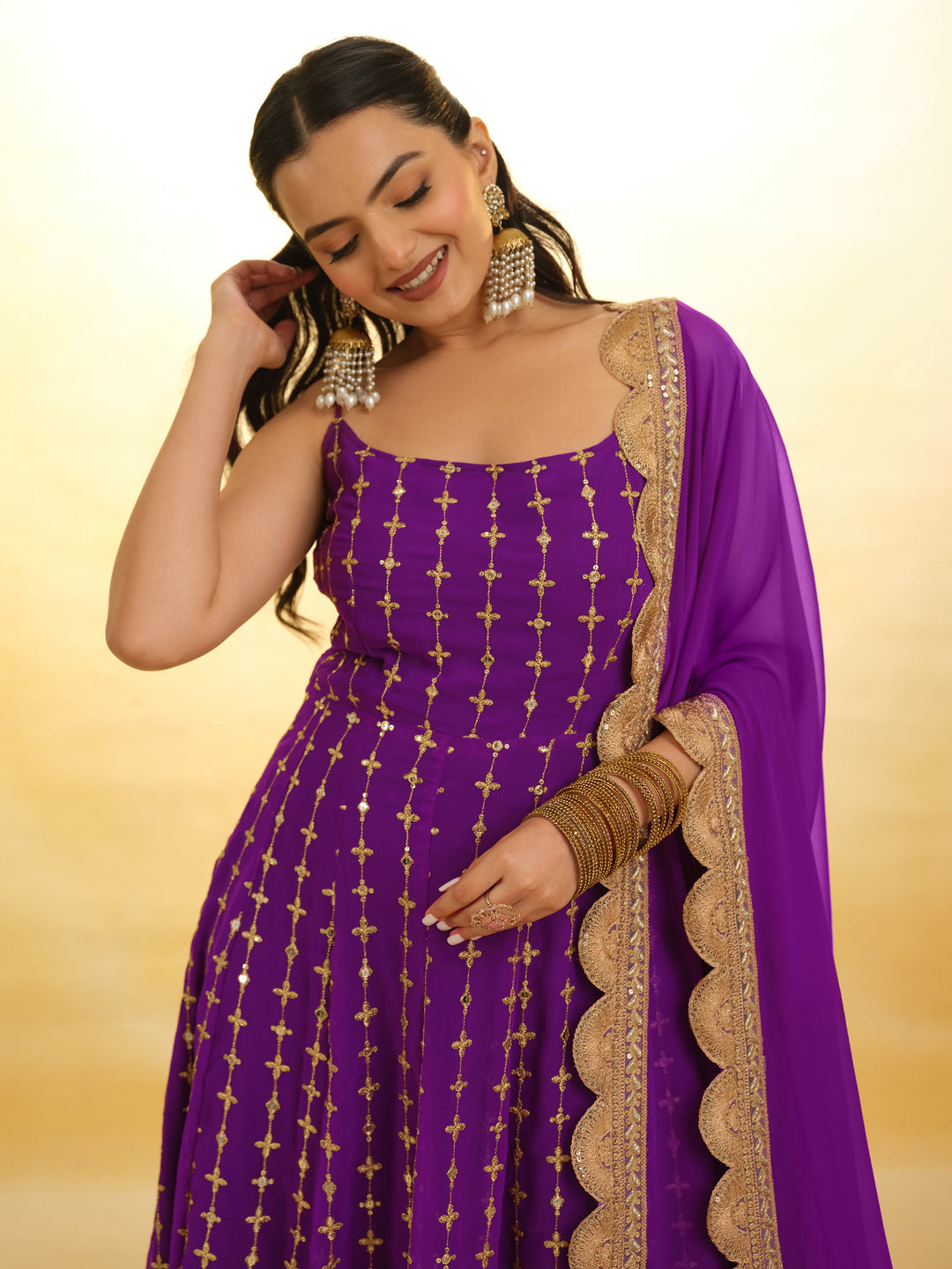 Captivating Purple Embroidered Georgette Wedding Wear Anarkali Suit with intricate detailing and flowing silhouette