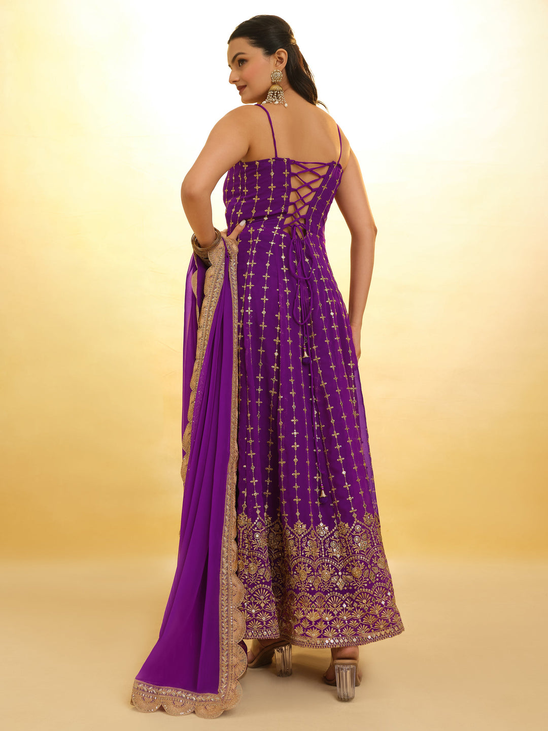 Captivating Purple Embroidered Georgette Wedding Wear Anarkali Suit with intricate detailing and flowing silhouette
