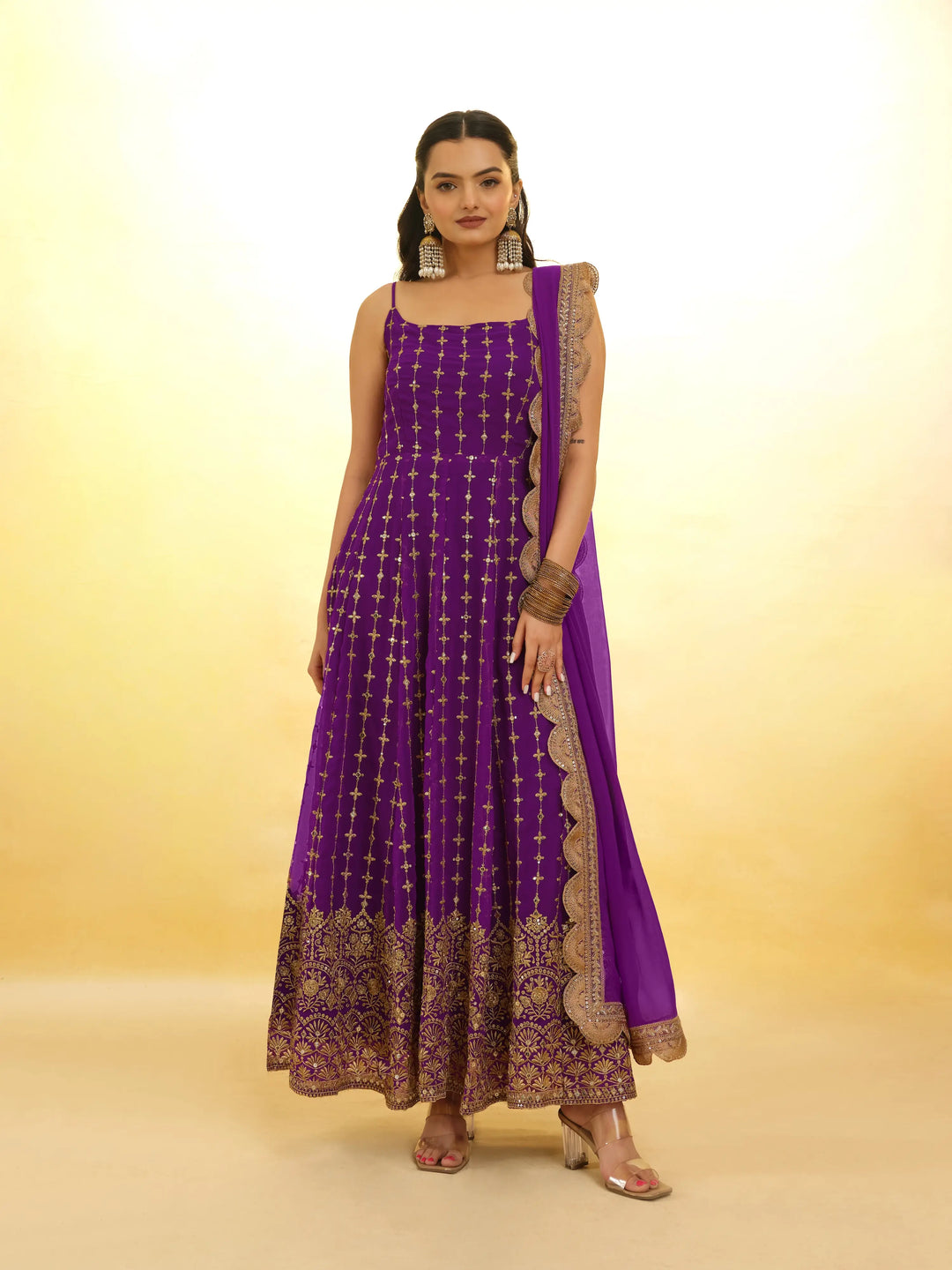 Beautiful purple salwar suit with intricate embroidery and traditional design