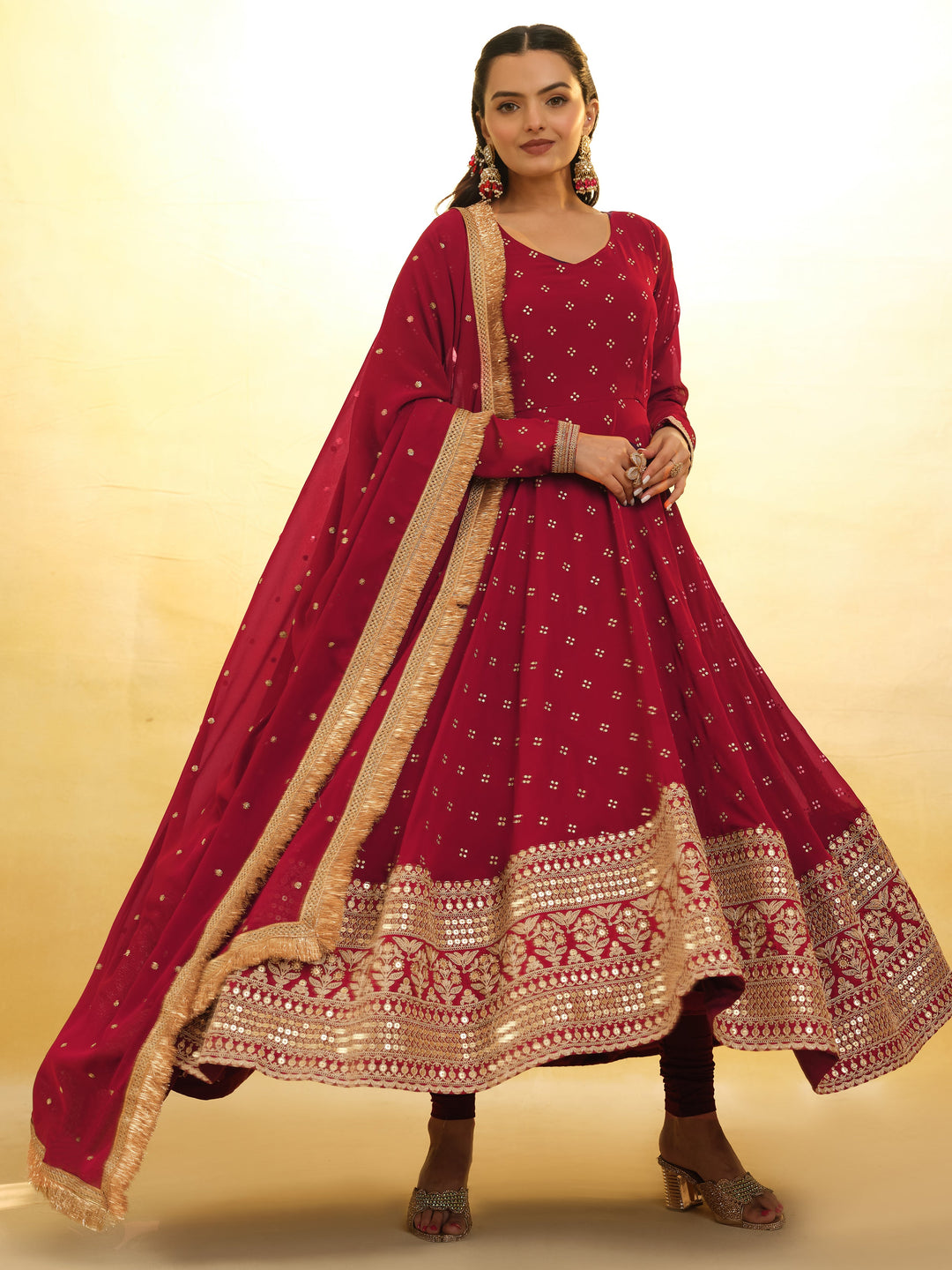 Red georgette suit with intricate embroidery and sequin detailing