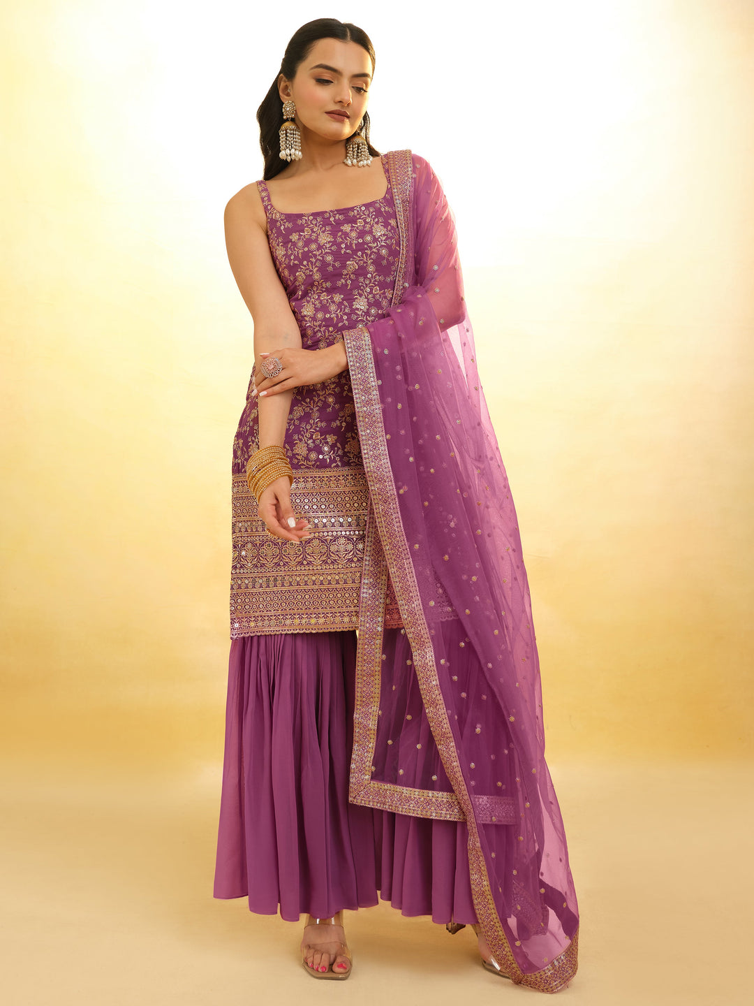 Delicate embroidery on luxurious purple sharara suit