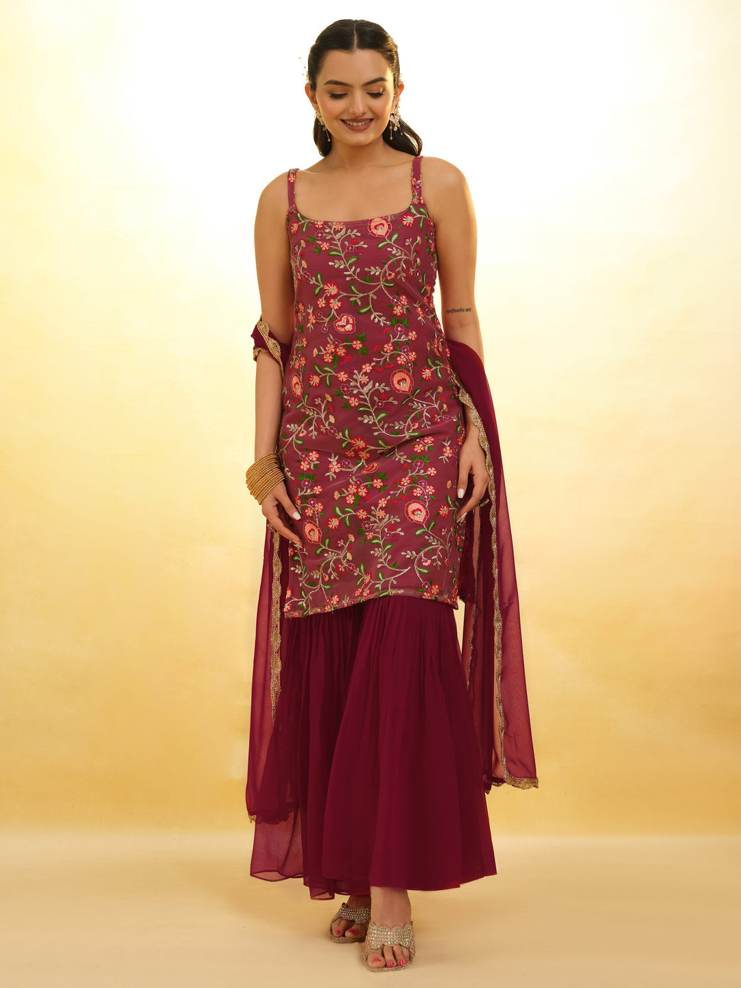 Maroon embroidered net sharara suit with intricate detailing for festivals
