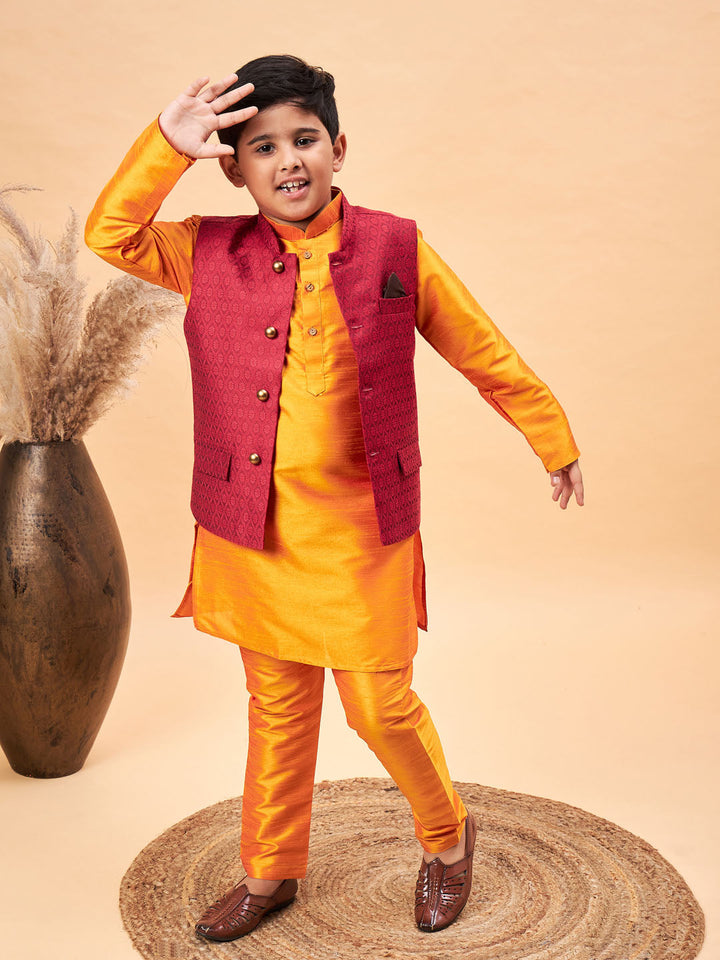 VASTRAMAY Boy's Maroon Woven Nehru Jacket With Orange Kurta And Pyjama Set - qivii