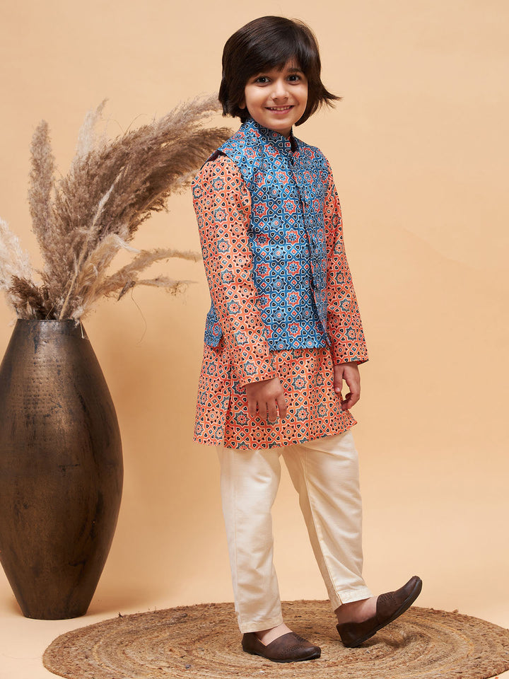 VASTRAMAY Boy's Orange Printed Kurta And Cream Pyjama Set With Blue Nehru Jacket - qivii
