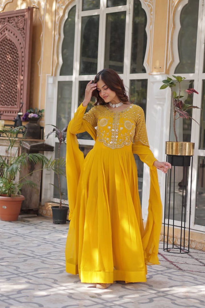 Yellow Faux Blooming Georgette With Attractive embroidered Work Gown - qivii