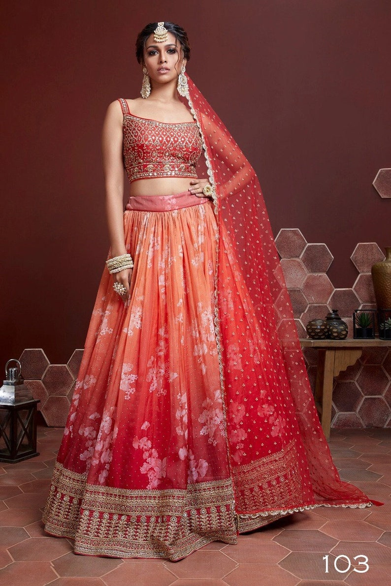 

Sabyasachi designer orange lehenga choli with heavy embroidery work and sequins embellishments in Georgette material