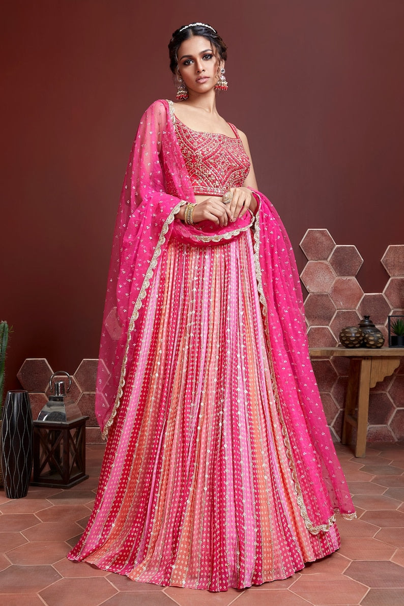  
Indian ethnics wear lehenga choli with heavy sequence embroidery work in Georgette material embellished with sequins, designed for wedding season