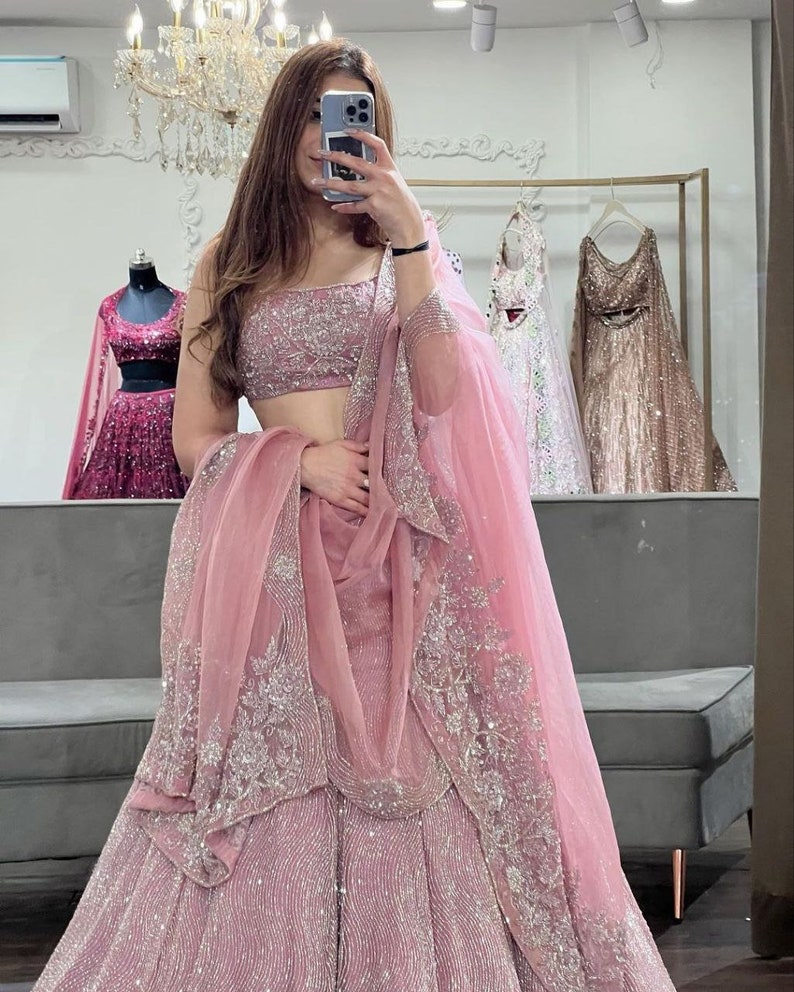 Sabyasachi Designer peach-pink Lehenga Choli with Shimmer Dori Work